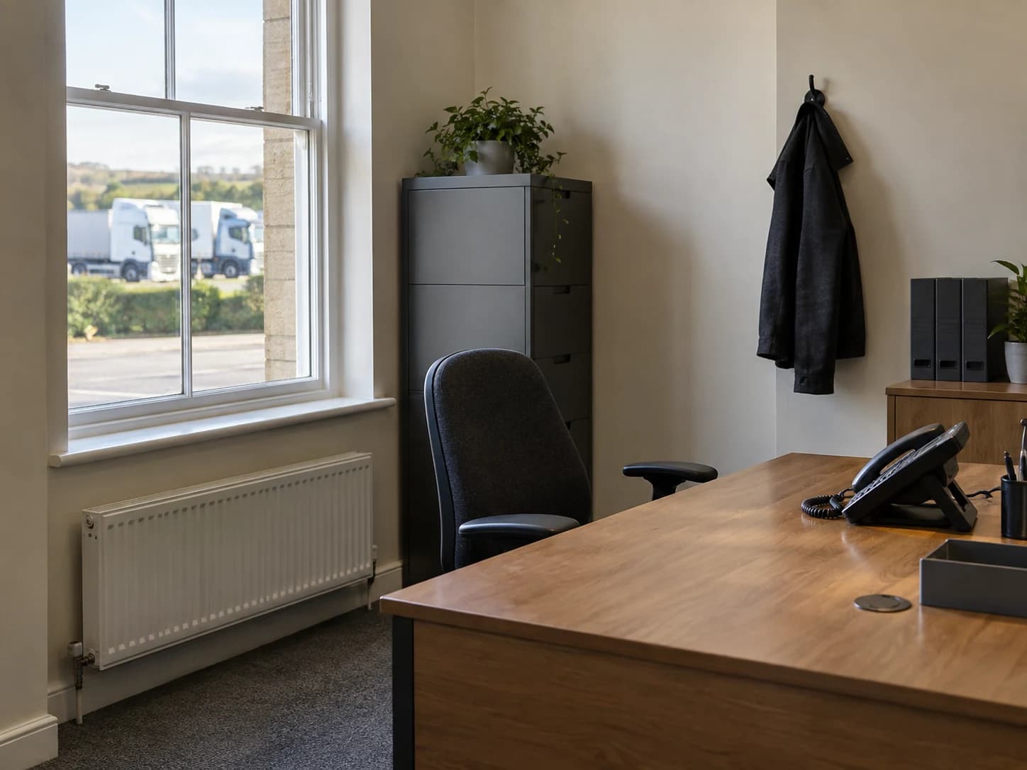 Illustrative transport office interior with a dispatch telephone by the window